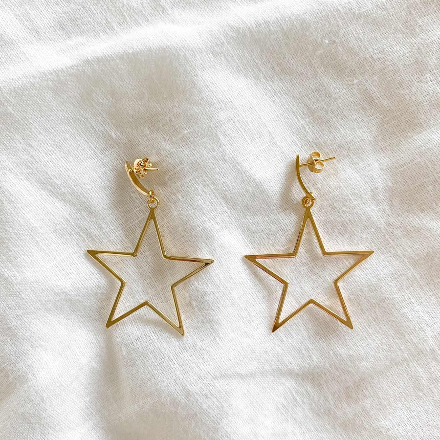 Aros estrellas largos oro